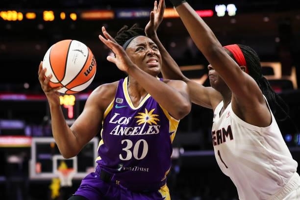 Nneka Ogwumike of the Los Angeles Sparks looks to shoot against Elizabeth Williams of the Atlanta Dream at Staples Center on August 19, 2021 in Los...