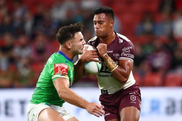 Tevita Funa of the Sea Eagles is tackled by Harley Smith-Shields of the Raiders during the round 23 NRL match between the Canberra Raiders and the...