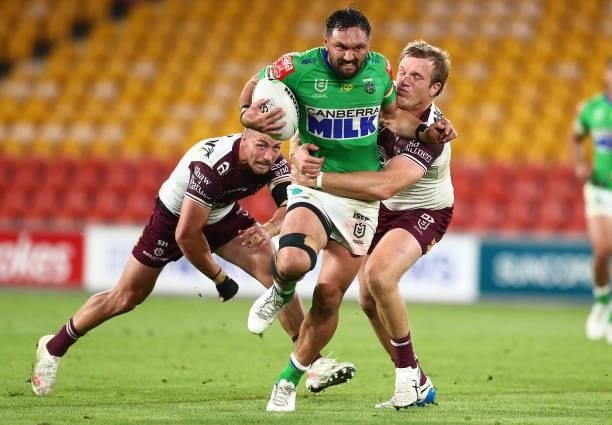 Jordan Rapana of the Raiders is tackled by Jake Trbojevic of the Sea Eagles during the round 23 NRL match between the Canberra Raiders and the Manly...