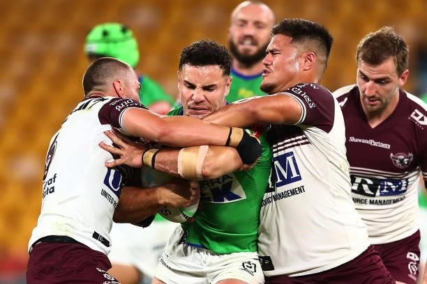 Harley Smith-Shields of the Raiders is tackled during the round 23 NRL match between the Canberra Raiders and the Manly Sea Eagles at Suncorp...