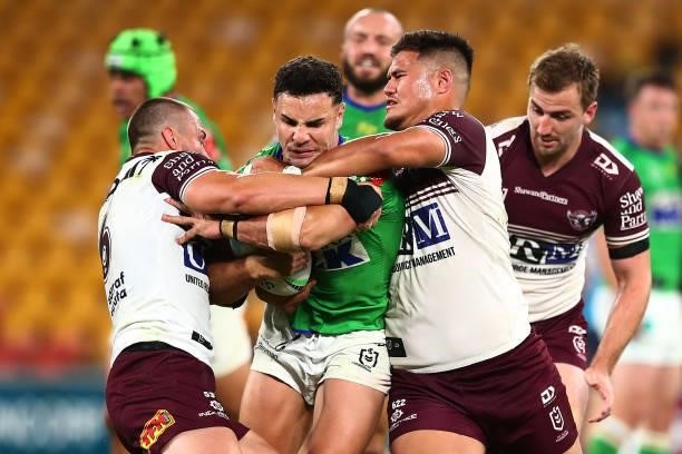 Harley Smith-Shields of the Raiders is tackled during the round 23 NRL match between the Canberra Raiders and the Manly Sea Eagles at Suncorp...