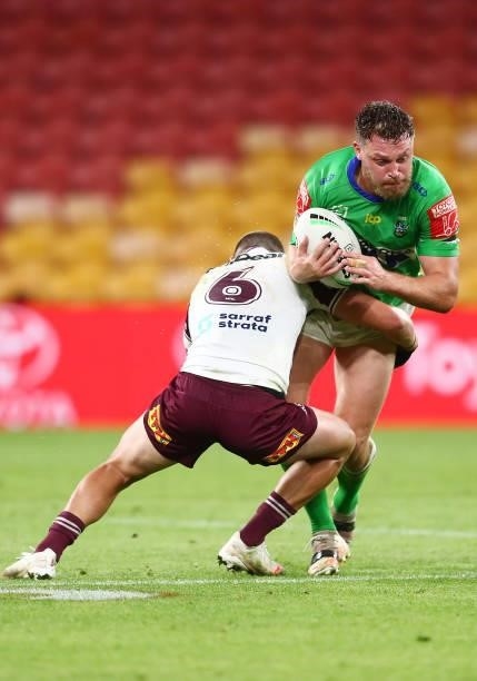 Elliott Whitehead of the Raiders is tackled by Kieran Foran of the Sea Eagles during the round 23 NRL match between the Canberra Raiders and the...