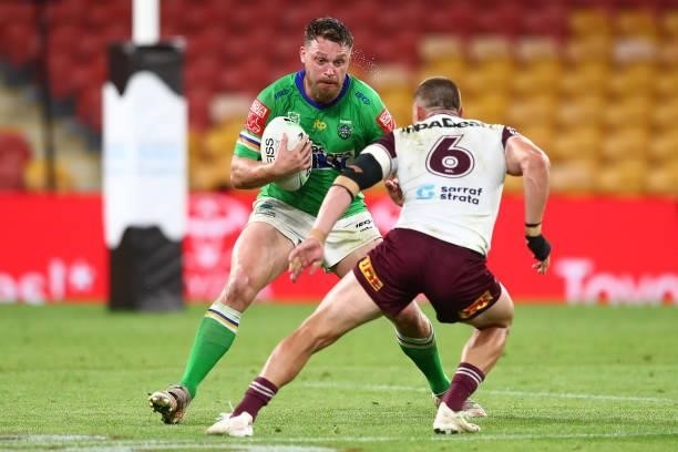 Elliott Whitehead of the Raiders is tackled by Kieran Foran of the Sea Eagles during the round 23 NRL match between the Canberra Raiders and the...
