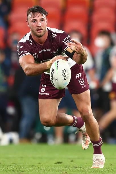 Karl Lawton of the Sea Eagles passes during the round 23 NRL match between the Canberra Raiders and the Manly Sea Eagles at Suncorp Stadium, on...