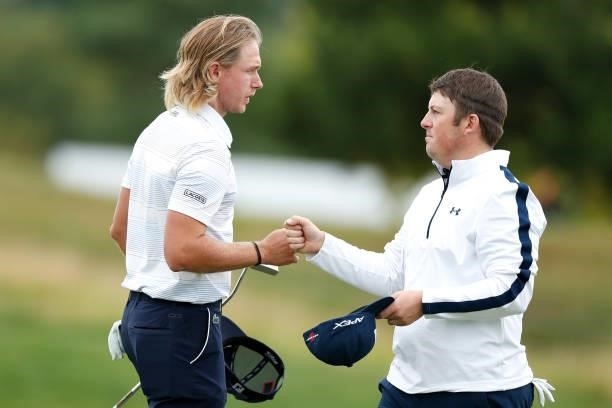 Maverick Antcliff of Australia fist bumps Dave Coupland of England after their round during Day Two of The D+D Real Czech Masters at Albatross Golf...