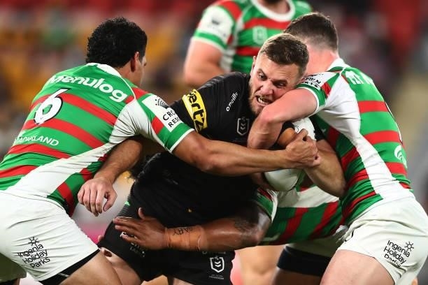 Kurt Capewell of the Panthers is tackled during the round 23 NRL match between the Penrith Panthers and the South Sydney Rabbitohs at Suncorp...