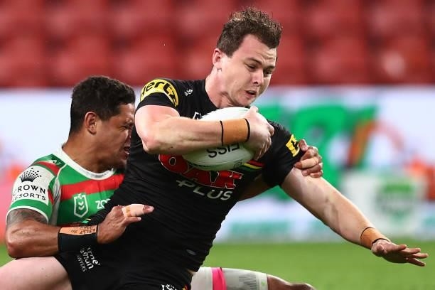 Dylan Edwards of the Panthers is tackled by Dane Gagai of the Rabbitohs during the round 23 NRL match between the Penrith Panthers and the South...