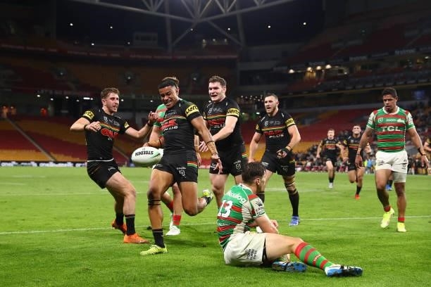 Stephen Crichton of the Panthers celebrates scoring a try with team mates during the round 23 NRL match between the Penrith Panthers and the South...
