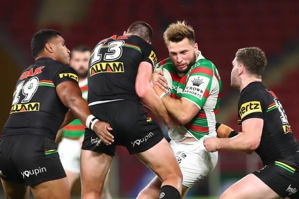 Jacob Host of the Rabbitohs is tackled during the round 23 NRL match between the Penrith Panthers and the South Sydney Rabbitohs at Suncorp Stadium,...
