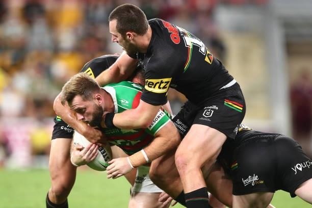 Jacob Host of the Rabbitohs is tackled during the round 23 NRL match between the Penrith Panthers and the South Sydney Rabbitohs at Suncorp Stadium,...