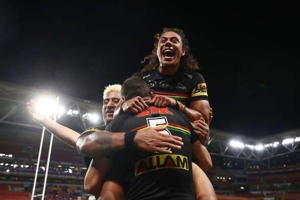 Brent Naden of the Panthers celebrates scoring a try with team mates Jerome Luai and Viliame Kikau of the Panthers during the round 23 NRL match...