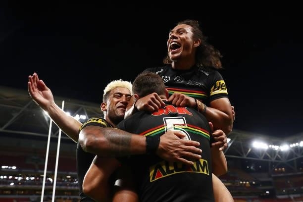 Brent Naden of the Panthers celebrates scoring a try with team mates Jerome Luai and Viliame Kikau of the Panthers during the round 23 NRL match...