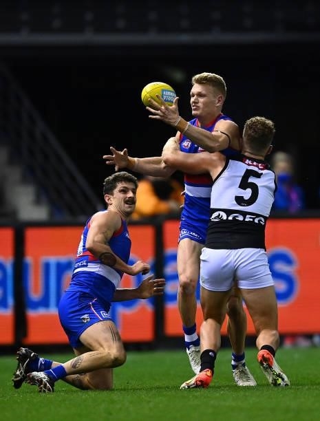 Adam Treloar of the Bulldogs is tackled by Dan Houston of the Power during the round 23 AFL match between Western Bulldogs and Port Adelaide Power at...