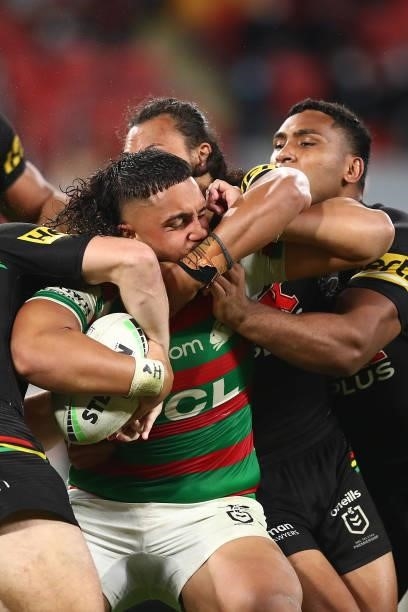 Keaon Koloamatangi of the Rabbitohs is tackled during the round 23 NRL match between the Penrith Panthers and the South Sydney Rabbitohs at Suncorp...