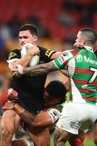 Nathan Cleary of the Panthers is tackled by Adam Reynolds of the Rabbitohs during the round 23 NRL match between the Penrith Panthers and the South...