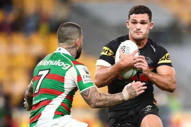 Nathan Cleary of the Panthers is tackled by Adam Reynolds of the Rabbitohs during the round 23 NRL match between the Penrith Panthers and the South...