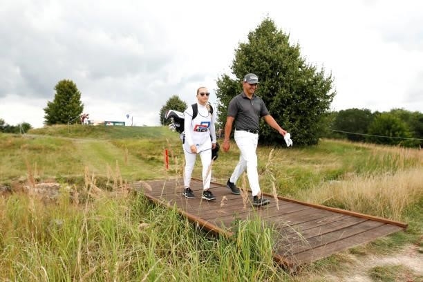Sebastian Vida of Slovakia makes his way along the ninth hole with his caddie during Day Two of The D+D Real Czech Masters at Albatross Golf Resort...
