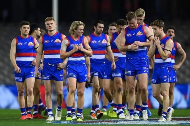 The Bulldogs look dejected following the round 23 AFL match between Western Bulldogs and Port Adelaide Power at Marvel Stadium on August 20, 2021 in...