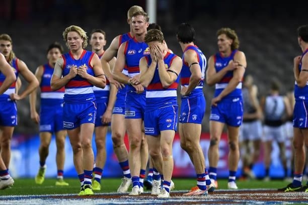 The Bulldogs look dejected following the round 23 AFL match between Western Bulldogs and Port Adelaide Power at Marvel Stadium on August 20, 2021 in...
