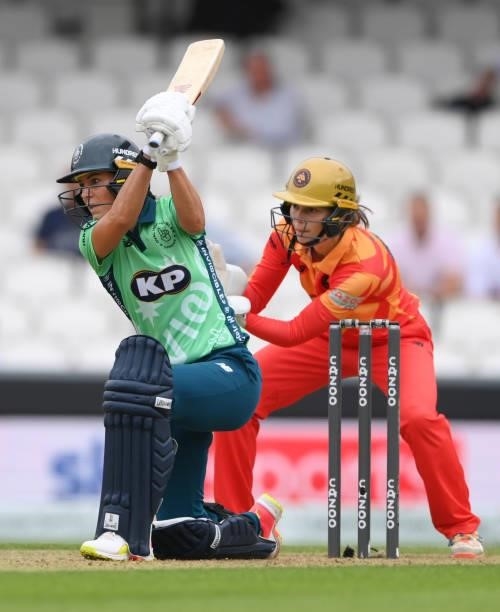Phoenix wicketkeeper Amy Jones looks on as Oval batter Marizanne Kapp hits out during the Eliminator match of The Hundred between Oval Invincibles...