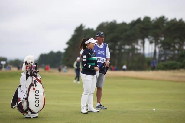 Moriya Jutanugarn of Thailand talks with her caddie as she prepares to play plays her second shot on the fourteenth hole during Day Two of the AIG...