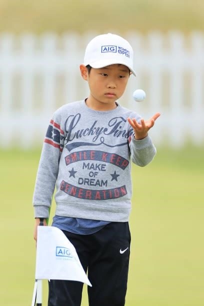 Young golf fan on the practice putting green in the Spectator Village during Day Two of the AIG Women's Open at Carnoustie Golf Links on August 20,...