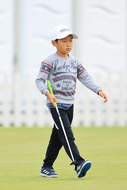 Young golf fan looks across the practice putting green in the Spectator Village during Day Two of the AIG Women's Open at Carnoustie Golf Links on...
