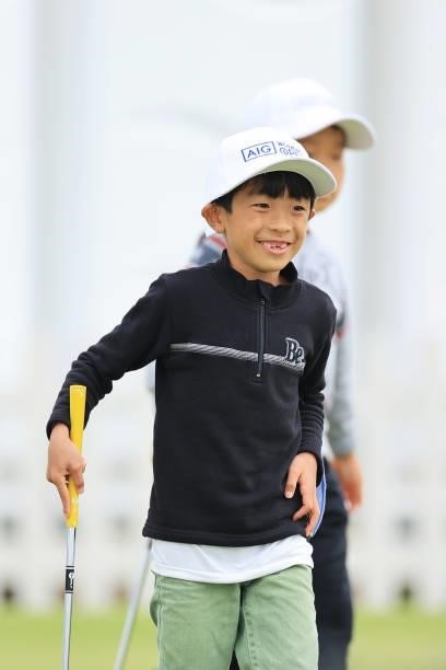 Young golf fan looks across the practice putting green in the Spectator Village during Day Two of the AIG Women's Open at Carnoustie Golf Links on...