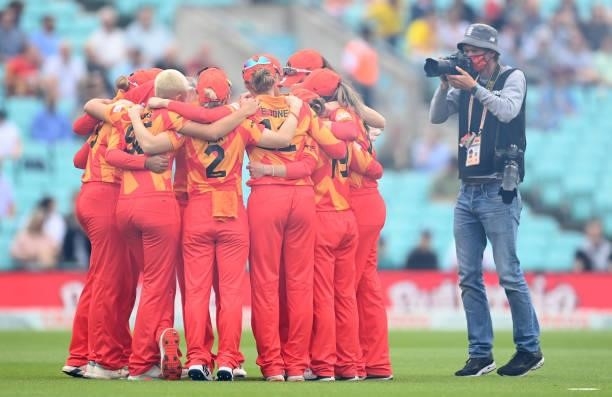 The Birmingham Phoenix team form a huddle as Getty Images photographer Gareth Copley photographs them before the Eliminator match of The Hundred...