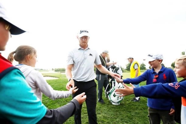 Sebastian Soderberg of Sweden interacts with fans after his round during Day Two of The D+D Real Czech Masters at Albatross Golf Resort on August 20,...