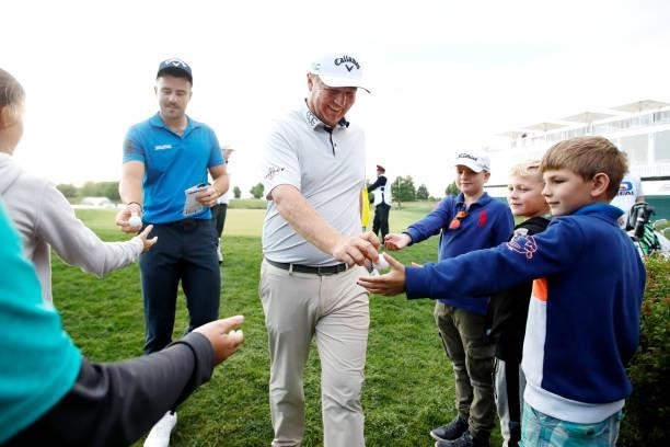 Toby Tree and Ross McGowan of England interact with fans after their round during Day Two of The D+D Real Czech Masters at Albatross Golf Resort on...