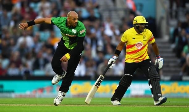 Tymal Mills of Southern Brave Men in bowling action as Samit Patel of Trent Rockets Men looks on during the Eliminator match of The Hundred between...