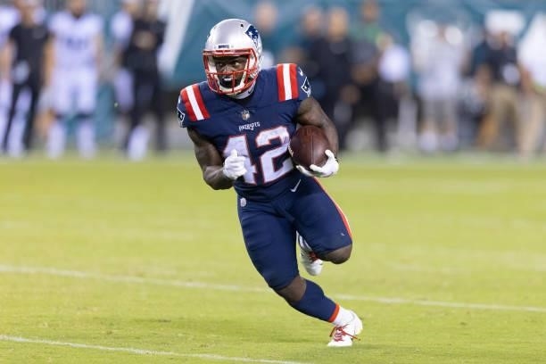 Taylor of the New England Patriots runs the ball against the Philadelphia Eagles in the second half of the preseason game at Lincoln Financial Field...