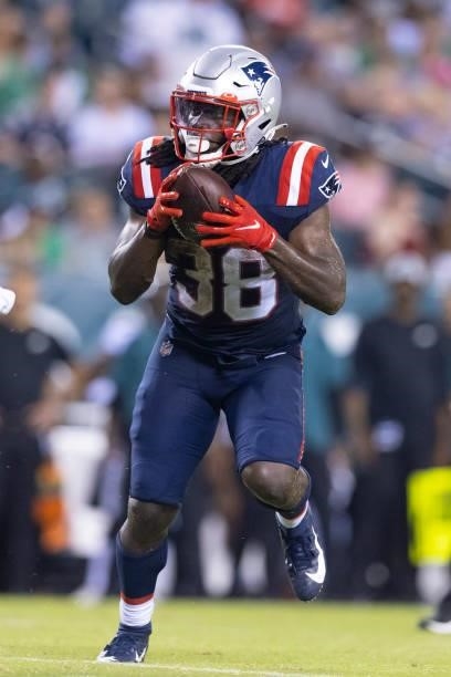 Rhamondre Stevenson of the New England Patriots runs the ball against the Philadelphia Eagles in the second half of the preseason game at Lincoln...