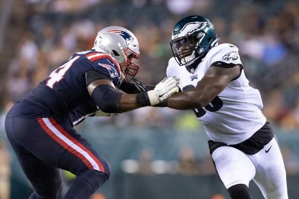Korey Cunningham of the New England Patriots attempts to block Milton Williams of the Philadelphia Eagles in the second half of the preseason game at...