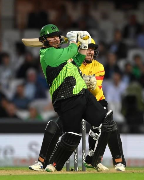 Rockets wicketkeeper Tom Moores looks on as Brave batter Paul Stirling hits out for 6 runs during the Eliminator match of The Hundred between...