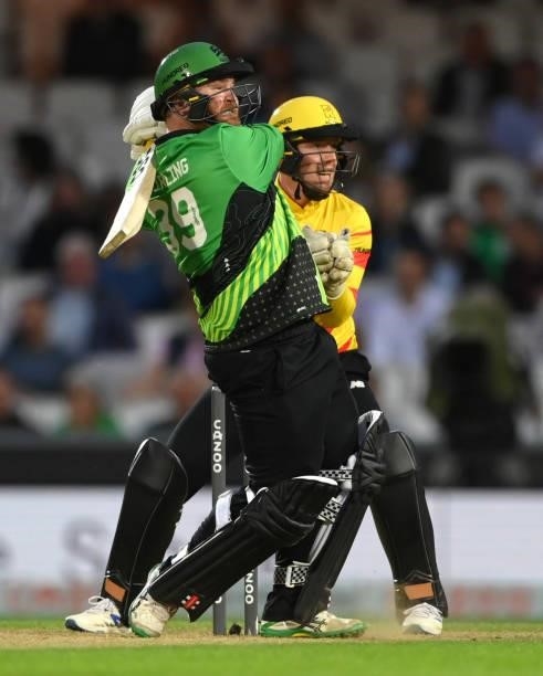 Rockets wicketkeeper Tom Moores looks on as Brave batter Paul Stirling hits out for 6 runs during the Eliminator match of The Hundred between...