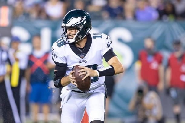 Nick Mullens of the Philadelphia Eagles scrambles against the New England Patriots in the preseason game at Lincoln Financial Field on August 19,...