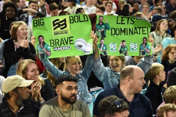 Fans of Southern Brave Men hold up signs in the crowd during the Eliminator match of The Hundred between Southern Brave Men and Trent Rockets Men at...