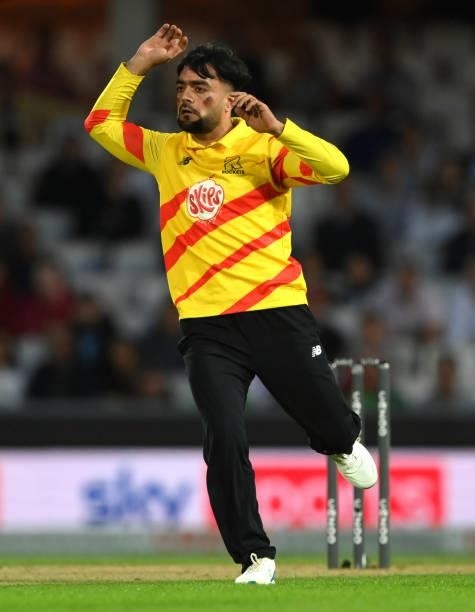 Rockets bowler Rashid Khan with the colours of the Afghanistan flag painted on his face reacts during the Eliminator match of The Hundred between...