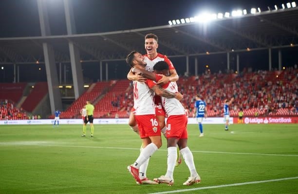 Jose Carlos Lazo Romero of UD Almeria celebrates with team mates after scoring his team's first goal during the LaLiga Smartbank match between UD...