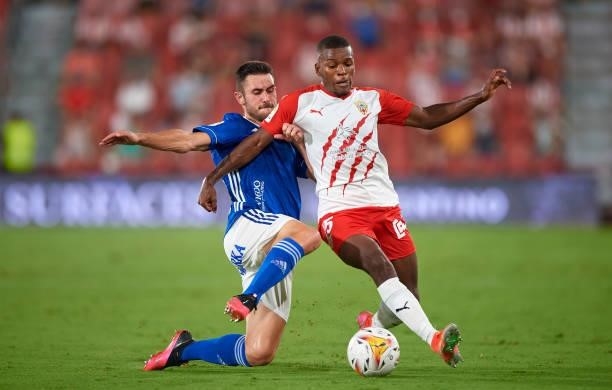 Sergio Akieme Rodriguez of UD Almeria competes for the ball with Lucas Ahijado Quintana of Real Oviedo during the LaLiga Smartbank match between UD...