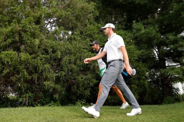 Patrick Cantlay of the United States walks with caddie Michael Greller to the 16th tee during the second round of THE NORTHERN TRUST, the first event...
