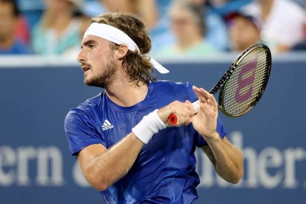 Stefanos Tsitsipas of Greece returns a shot to Felix Auger-Aliassime of Canada during the Western & Southern Open at Lindner Family Tennis Center on...