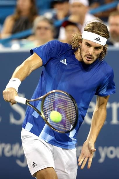 Stefanos Tsitsipas of Greece returns a shot to Felix Auger-Aliassime of Canada during the Western & Southern Open at Lindner Family Tennis Center on...