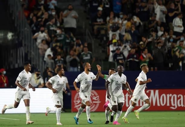 The Los Angeles Galaxy celebrate a goal against the San Jose Earthquakes in the second half at Dignity Health Sports Park on August 20, 2021 in...