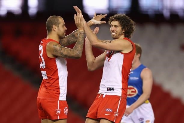 Lance Franklin of the Swans celebrates kicking a goal with Tom Hickey of the Swans during the round 23 AFL match between Sydney Swans and Gold Coast...