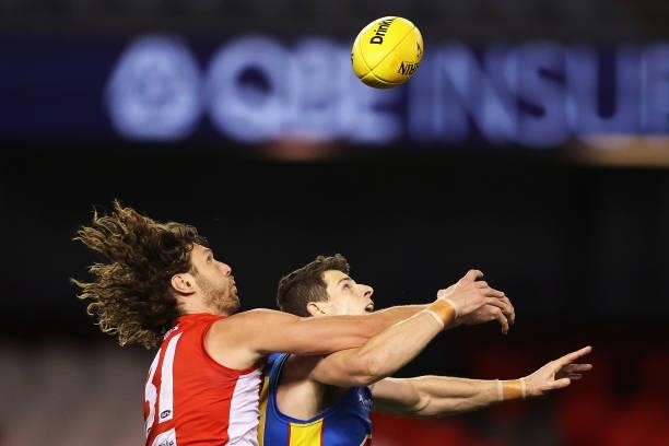 Tom Hickey of the Swans and Chris Burgess of the Suns contest the ball during the round 23 AFL match between Sydney Swans and Gold Coast Suns at...
