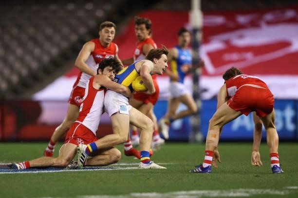 Noah Anderson of the Suns is tackled by George Hewett of the Swans during the round 23 AFL match between Sydney Swans and Gold Coast Suns at Marvel...