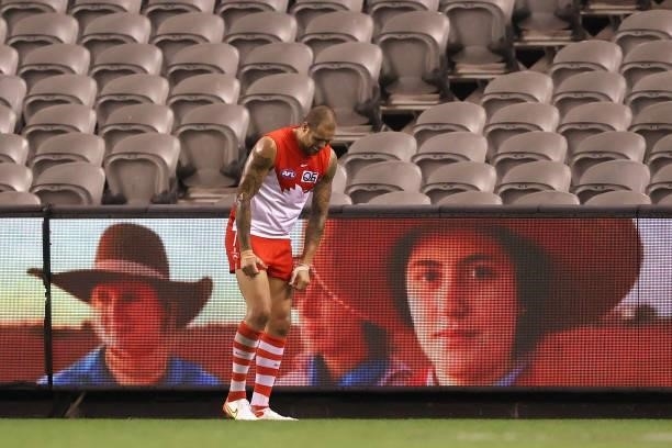 Lance Franklin of the Swans reacts after landing awkwardly during the round 23 AFL match between Sydney Swans and Gold Coast Suns at Marvel Stadium...
